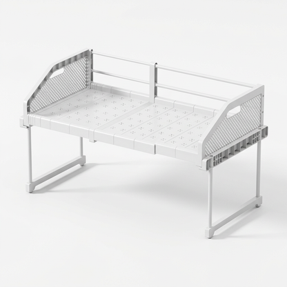 White expandable cabinet shelf riser with high side guards on white background